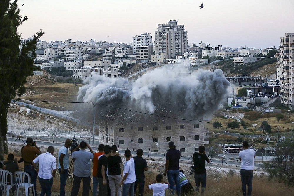 A Palestinian building is blown up by Israeli forces in the village of Sur Baher, East Jerusalem, July 22, 2019. (Wisam Hashlamoun/Flash90)
