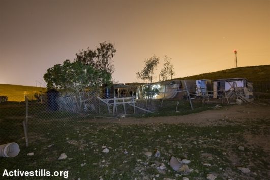 A structure used to house a family in the Palestinian Bedouin community of Khan al-Ahmar, West Bank, February 23, 2017. (Faiz Abu Rmeleh/Activestills.org)