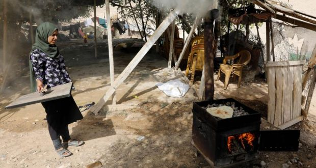 A woman bakes bread in the Palestinian Bedouin village of Khan al-Ahmar, east of Jerusalem, in the occupied West Bank, on October 21st, 2018 Photograph: Menahem Kahana/AFP/Getty