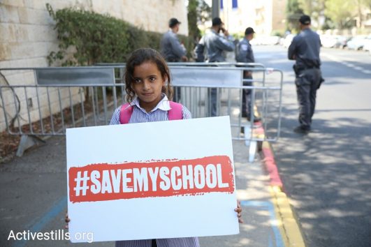 Dozens of schoolchildren from the Khan al-Ahmar eco-school demonstrate outside the president’s residence in Jerusalem, demanding Chancellor Angela Merkel intervene and prevent Israel from demolishing their school, October 4, 2018. (Oren Ziv/Activestills.org)