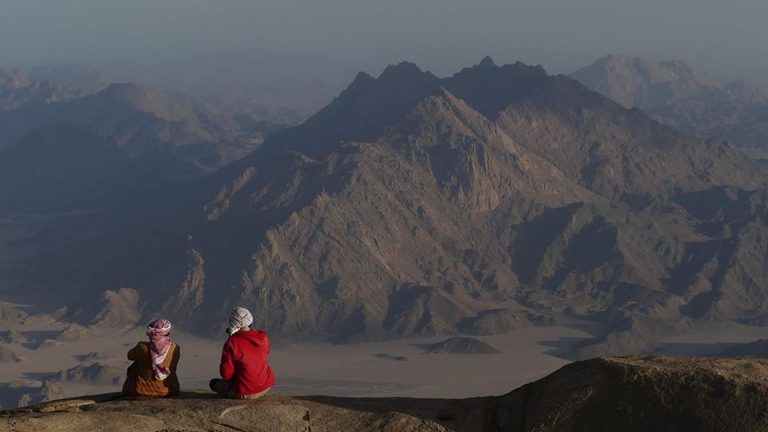 Bedouin tribesmen gaze out to Jebel Um Anab, from Jebel Shayib el Banat. Credit: Ben Hoffler/ Red Sea Mountain Trail